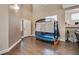 Front room view of a high ceiling foyer with hardwood floors and an adjacent living room at 9746 Vista Cache Ct, Las Vegas, NV 89148