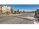 Gated entrance to the community with mature landscaping at 10239 Meandering Dell Ave, Las Vegas, NV 89166