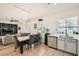 Open concept dining area/kitchen with stainless appliances, eat in dining and natural light at 10413 Rising Harbor Ave, Las Vegas, NV 89129