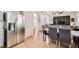 Open concept dining area with stainless appliances, eat in dining and flows to living area at 10413 Rising Harbor Ave, Las Vegas, NV 89129