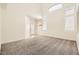 Entryway features neutral paint, carpet, vaulted ceilings, ample natural light and recessed lighting at 10413 Rising Harbor Ave, Las Vegas, NV 89129