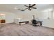 Loft space with a desk, ceiling fan, sewing machine, and a cozy lounge area offering flexibility at 10413 Rising Harbor Ave, Las Vegas, NV 89129