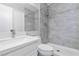 Modern bathroom featuring a walk-in shower with gray tile and a white vanity with a sink at 120 Wynntry Dr, Henderson, NV 89074