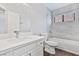 Bathroom showcasing a tub and shower combo, vanity, and decorative tiling at 120 Wynntry Dr, Henderson, NV 89074