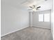 Bright bedroom featuring neutral walls, carpet, and a ceiling fan at 120 Wynntry Dr, Henderson, NV 89074