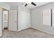 Bright bedroom features a ceiling fan, closet, and neutral carpeting at 120 Wynntry Dr, Henderson, NV 89074