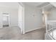 Hallway with neutral carpet and a view into a bathroom; multiple doors for flexible living options at 120 Wynntry Dr, Henderson, NV 89074