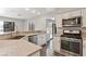 Well-equipped kitchen with stainless steel appliances and a view of the backyard at 120 Wynntry Dr, Henderson, NV 89074