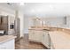 Kitchen with stainless steel appliances and stone countertops, and wood-style floors at 120 Wynntry Dr, Henderson, NV 89074