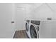 Bright laundry room with new, white, front-loading washer and dryer at 120 Wynntry Dr, Henderson, NV 89074