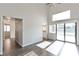 Bright living room with high ceilings, hardwood floors, and sliding doors to the backyard at 120 Wynntry Dr, Henderson, NV 89074