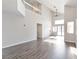 Spacious living room featuring soaring ceilings, lots of light, and stylish wood flooring at 120 Wynntry Dr, Henderson, NV 89074