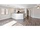 Bright living room with wood floors and views of the kitchen and hallway at 120 Wynntry Dr, Henderson, NV 89074