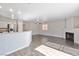 Spacious living room with fireplace, wood floors, and a view of the kitchen at 120 Wynntry Dr, Henderson, NV 89074