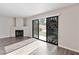 Bright living room with wood floors and fireplace, with a view of the backyard at 120 Wynntry Dr, Henderson, NV 89074