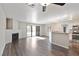 Open living room with fireplace, wood floors, and sliding glass door to backyard at 120 Wynntry Dr, Henderson, NV 89074