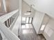 Bright living room with vaulted ceilings, hardwood floors, a ceiling fan, and a sliding glass door at 120 Wynntry Dr, Henderson, NV 89074