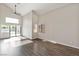 Bright living room with hardwood floors, high ceilings, and sliding doors to the backyard at 120 Wynntry Dr, Henderson, NV 89074