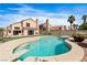 Backyard oasis with pool, manicured landscaping, and blue sky at 120 Wynntry Dr, Henderson, NV 89074