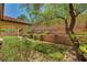 Landscaped backyard featuring grass area and rock border at 121 Staplehurst Ave, Henderson, NV 89002