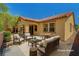 Landscaped backyard features patio seating area, perfect for outdoor entertaining at 121 Staplehurst Ave, Henderson, NV 89002