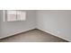 Neutral bedroom with a window letting in natural light and carpeted floors at 121 Staplehurst Ave, Henderson, NV 89002