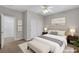 Comfortable bedroom featuring a queen-sized bed, soft lighting, and carpeted floors at 121 Staplehurst Ave, Henderson, NV 89002