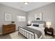 Nicely staged bedroom with modern furnishings, neutral colors, and an abundance of light at 121 Staplehurst Ave, Henderson, NV 89002