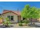 Charming single-story home showcasing desert landscaping, a red tile roof, and a welcoming entrance at 121 Staplehurst Ave, Henderson, NV 89002