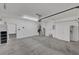 Spacious garage with concrete flooring, storage cabinets, and overhead lighting at 121 Staplehurst Ave, Henderson, NV 89002