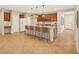 Spacious kitchen featuring a large island with seating, stainless steel appliances, and ample counter space at 121 Staplehurst Ave, Henderson, NV 89002