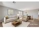 Inviting living room with comfortable seating, a dining area, and neutral decor at 121 Staplehurst Ave, Henderson, NV 89002