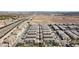 Aerial view showcases a community with desert surroundings, homes, and street at 12280 Golden Wreath Rd # 3, Las Vegas, NV 89183
