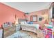 Bright bedroom featuring a comfortable bed, a mirror, and a decorative theme at 12280 Golden Wreath Rd # 3, Las Vegas, NV 89183