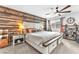 Cozy bedroom featuring a rustic wood accent wall, comfortable bed and stylish decor at 12280 Golden Wreath Rd # 3, Las Vegas, NV 89183