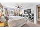 Spacious bedroom with a large bed, TV, fireplace, and comfortable seating area for relaxation at 12280 Golden Wreath Rd # 3, Las Vegas, NV 89183