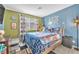 bedroom with playful decor, comfortable bed, and window with natural light at 12280 Golden Wreath Rd # 3, Las Vegas, NV 89183