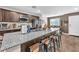 Modern kitchen with granite countertops, stainless steel appliances, and seating at the breakfast bar at 12280 Golden Wreath Rd # 3, Las Vegas, NV 89183