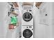 Convenient laundry room equipped with stacked washer and dryer and shelving at 12280 Golden Wreath Rd # 3, Las Vegas, NV 89183