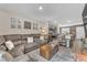 Open-concept living room showcasing comfortable seating, stylish decor, and seamless flow to the modern kitchen at 12280 Golden Wreath Rd # 3, Las Vegas, NV 89183