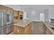 Open concept kitchen with granite countertops, stainless appliances and adjacent dining space at 1324 European Dr, Henderson, NV 89052