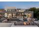 Luxurious backyard featuring a modern pool, water features, fire pit, and outdoor living spaces with mountain views at 1491 Reims Dr, Henderson, NV 89012