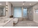 This bathroom has a large shower, soaking tub, and marble countertops at 1491 Reims Dr, Henderson, NV 89012