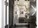 Contemporary bathroom with sleek black marble vanity, decorative lighting and a stylish design at 1491 Reims Dr, Henderson, NV 89012
