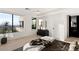 Bright bedroom with large windows offering city views and a modern styled dresser at 1491 Reims Dr, Henderson, NV 89012