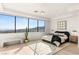 Bright and airy bedroom with a large window offering views, modern furnishings, and stylish decor at 1491 Reims Dr, Henderson, NV 89012