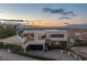 Modern home exterior with a multi-car garage and manicured landscaping, showcasing architectural design at 1491 Reims Dr, Henderson, NV 89012