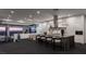 Sleek, modern kitchen with stainless steel appliances, large center island, and views of the city skyline at 1491 Reims Dr, Henderson, NV 89012