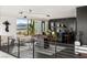 Open concept living space with city views, a bar area, a foosball table, and modern decor at 1491 Reims Dr, Henderson, NV 89012