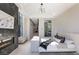 Luxurious main bedroom featuring fireplace, sleek TV stand, and lots of natural light at 1491 Reims Dr, Henderson, NV 89012